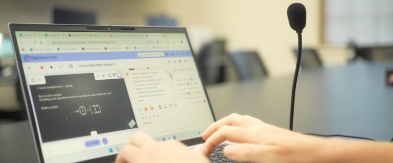 laptop connected to a speech recognition microphone